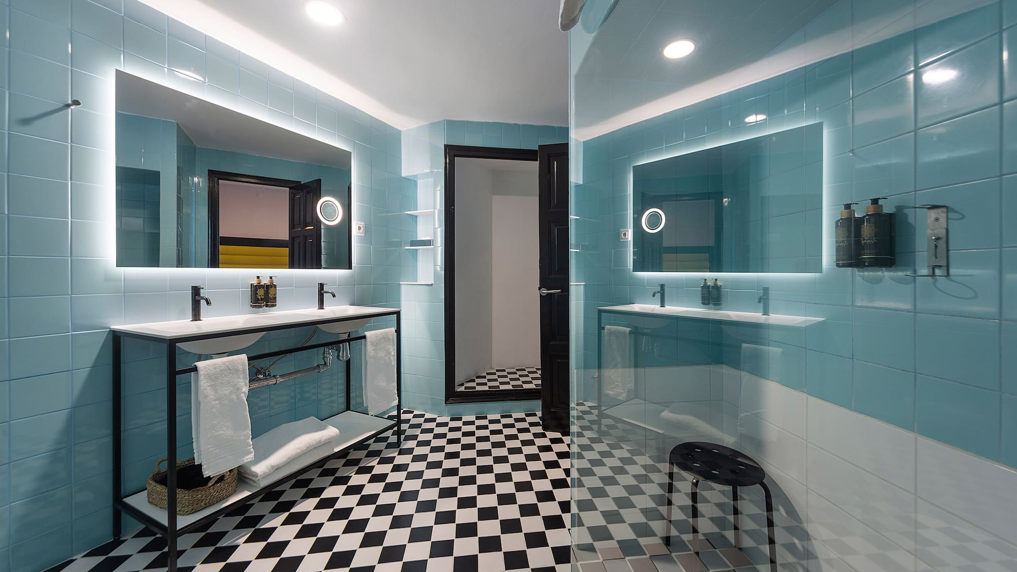 a bathroom with a mirror and a shower