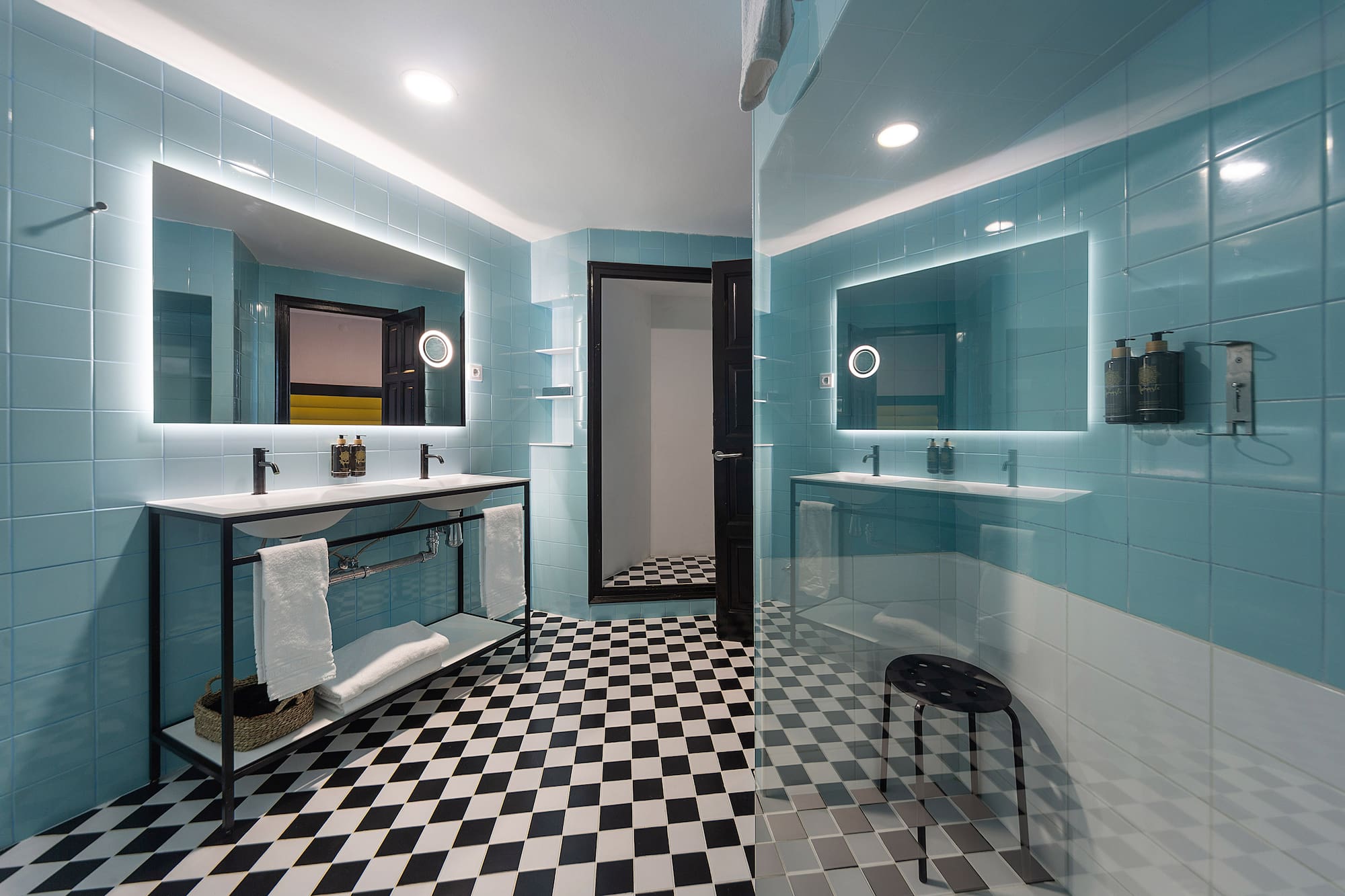 a bathroom with a mirror and a shower