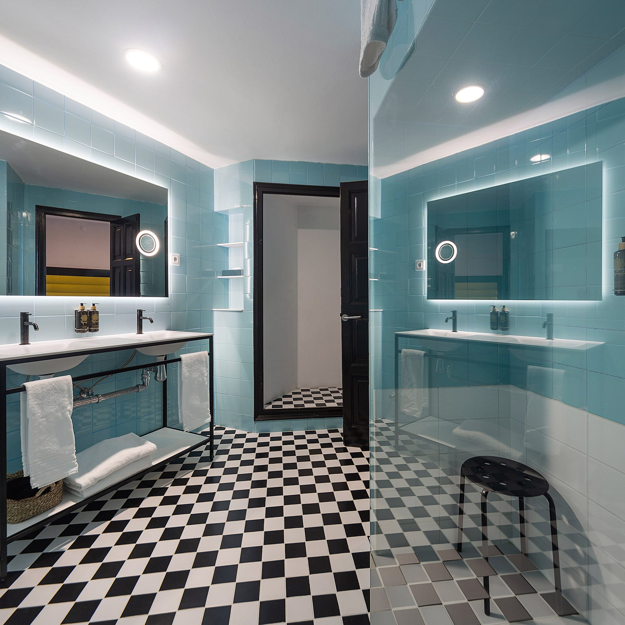 a bathroom with a mirror and a shower