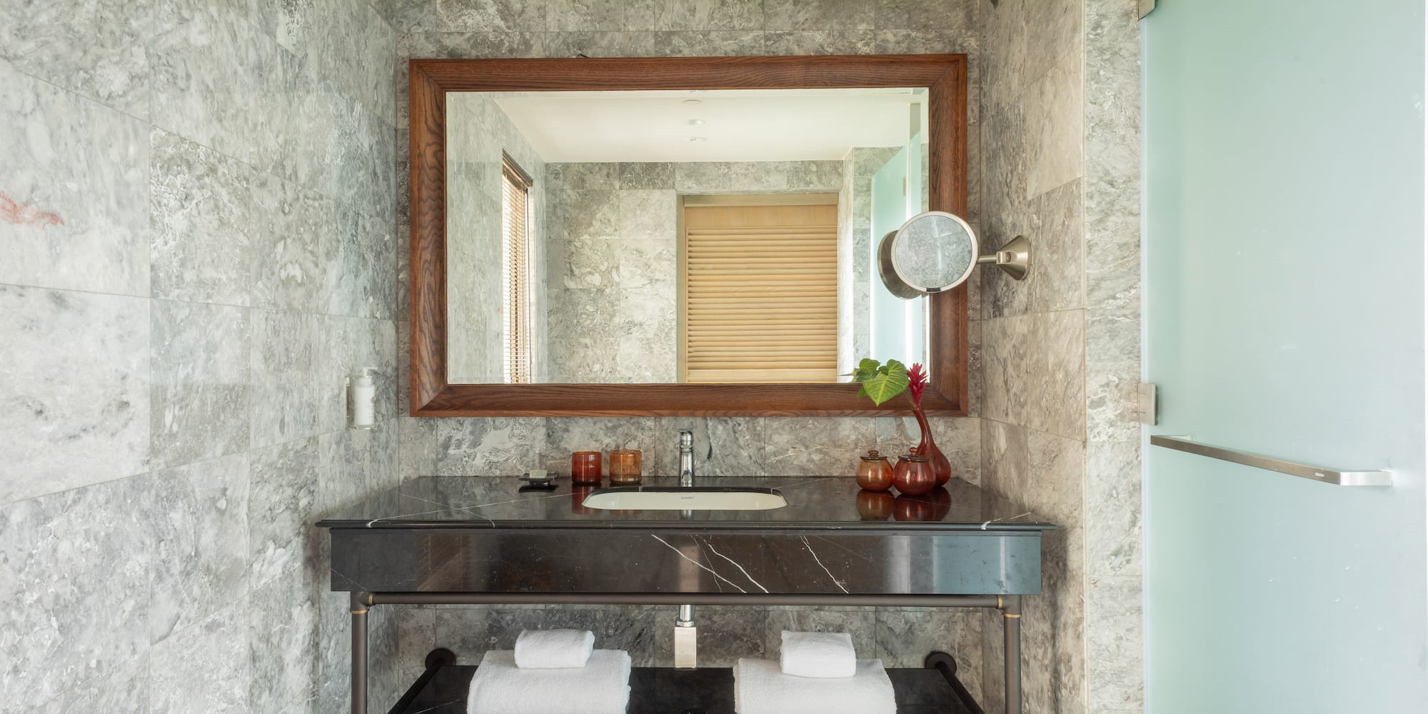 a bathroom with a mirror and a sink