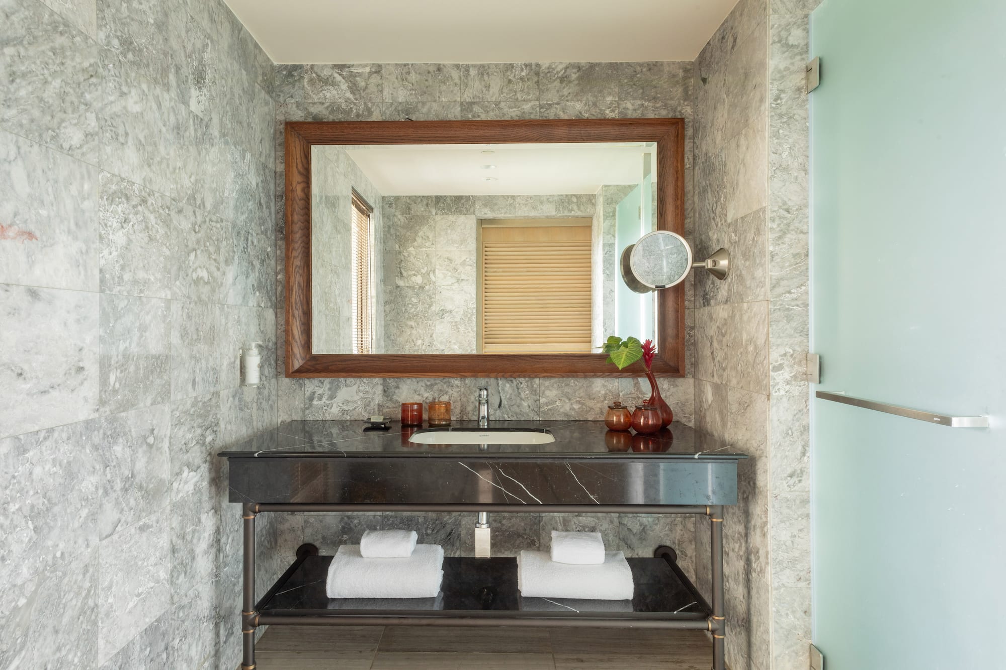 a bathroom with a mirror and a sink