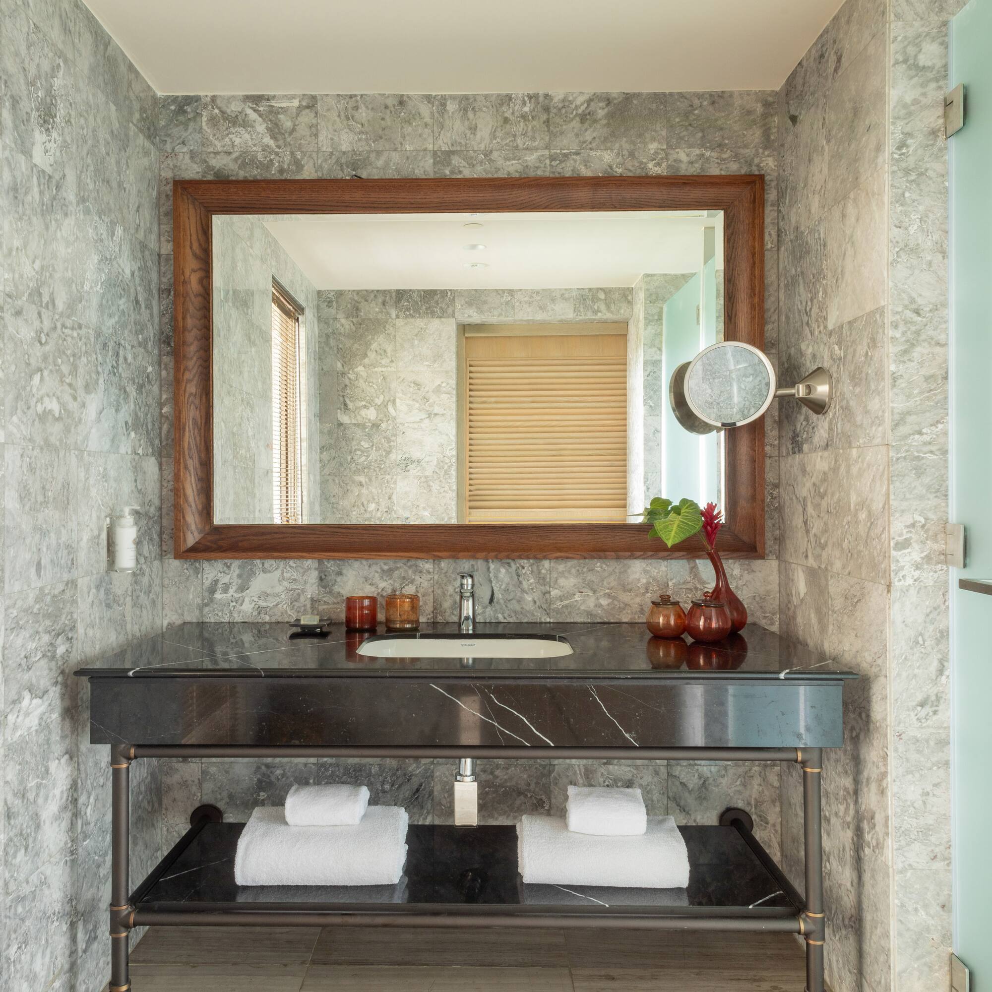a bathroom with a mirror and a sink