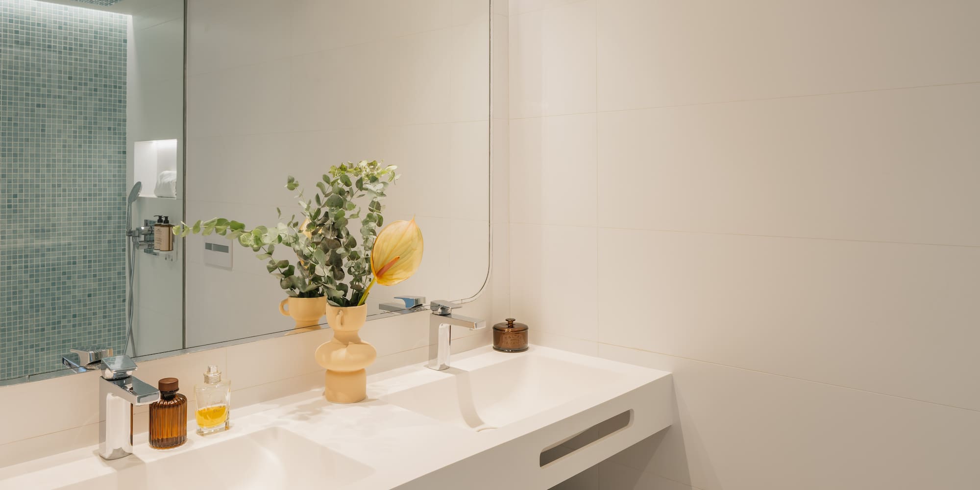 a bathroom with a mirror and sink