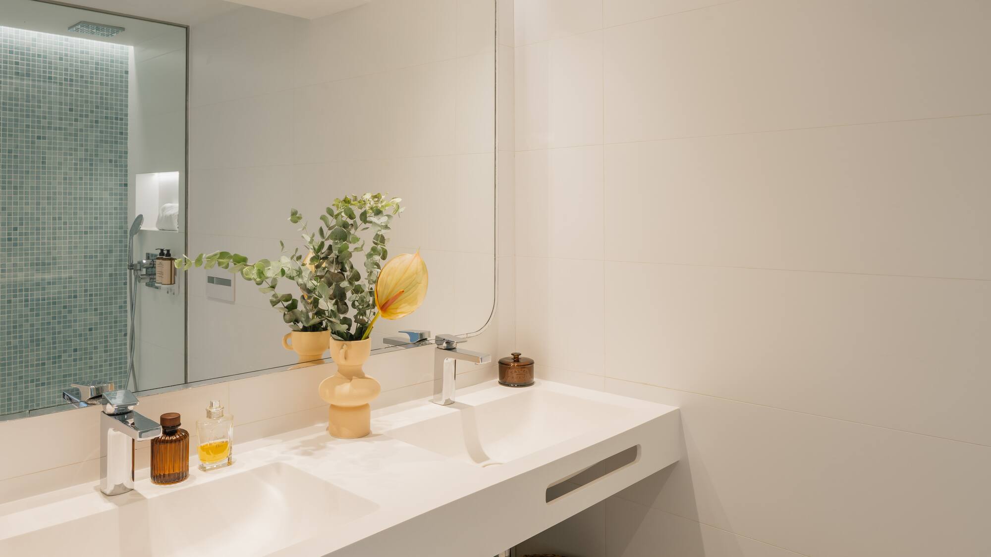 a bathroom with a mirror and sink