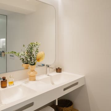 a bathroom with a mirror and sink