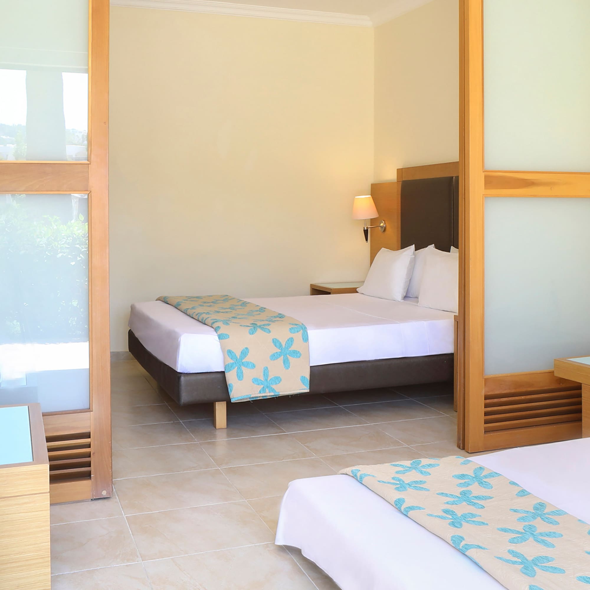 a room with two beds and a tv