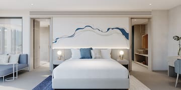 a bedroom with a bed and a rug