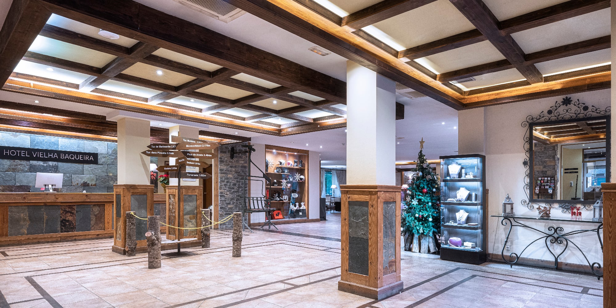 a large room with a stone floor and a display case