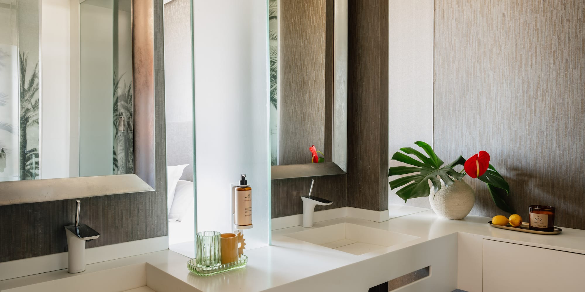 a bathroom with a large mirror and two sinks