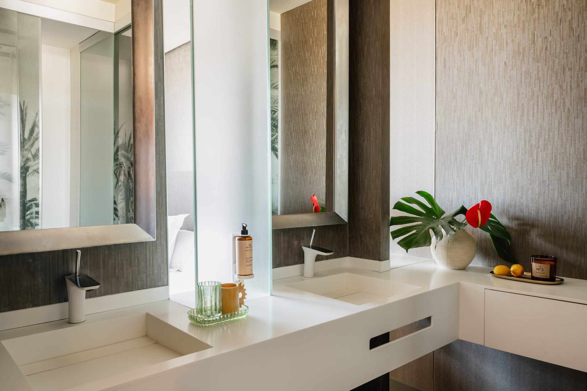 a bathroom with a large mirror and two sinks