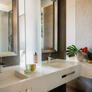 a bathroom with a large mirror and two sinks