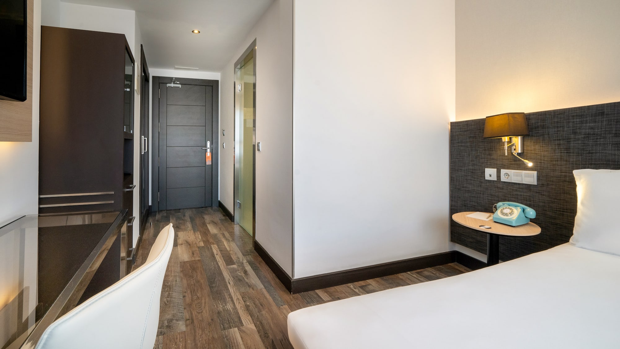 a room with a bed and a desk