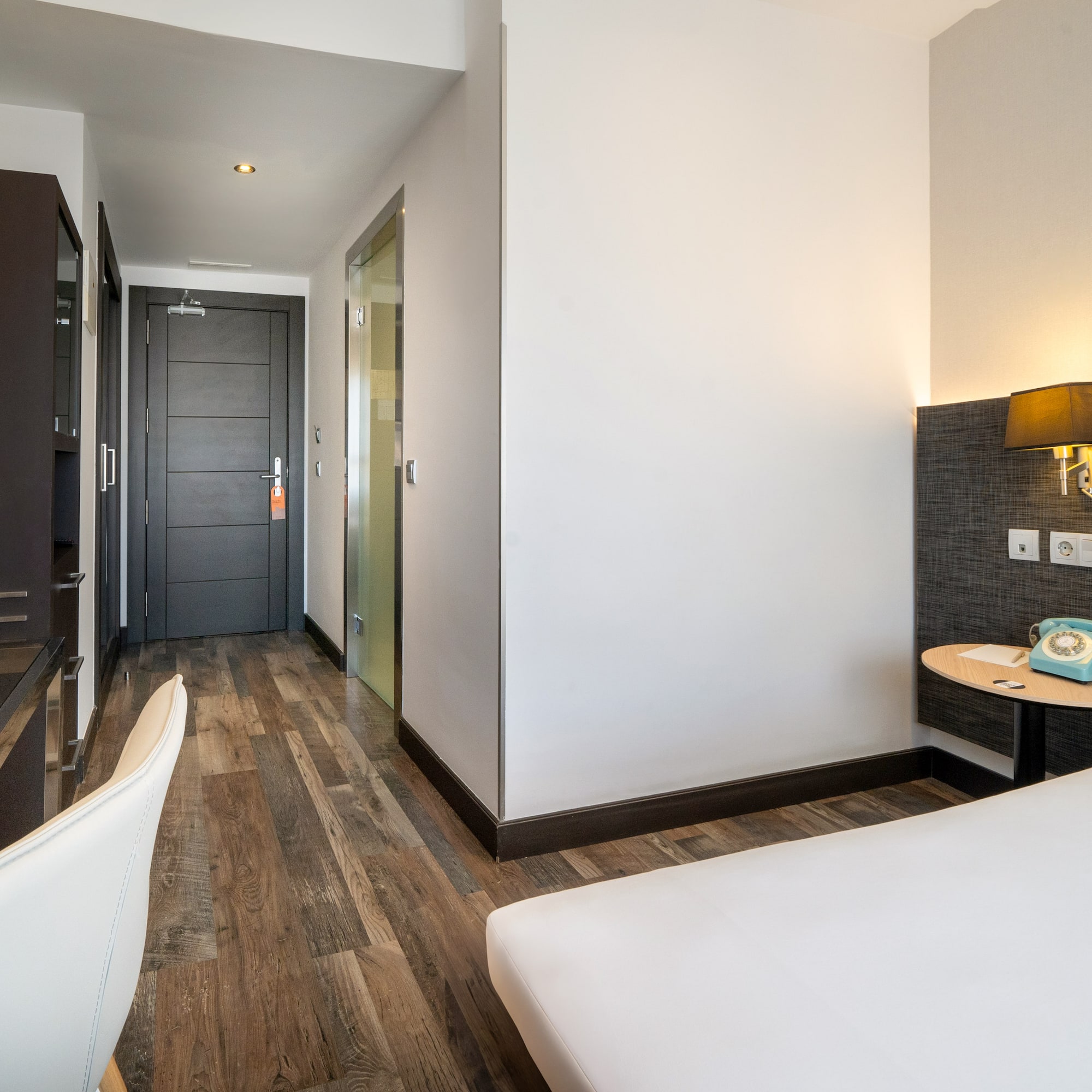 a room with a bed and a desk