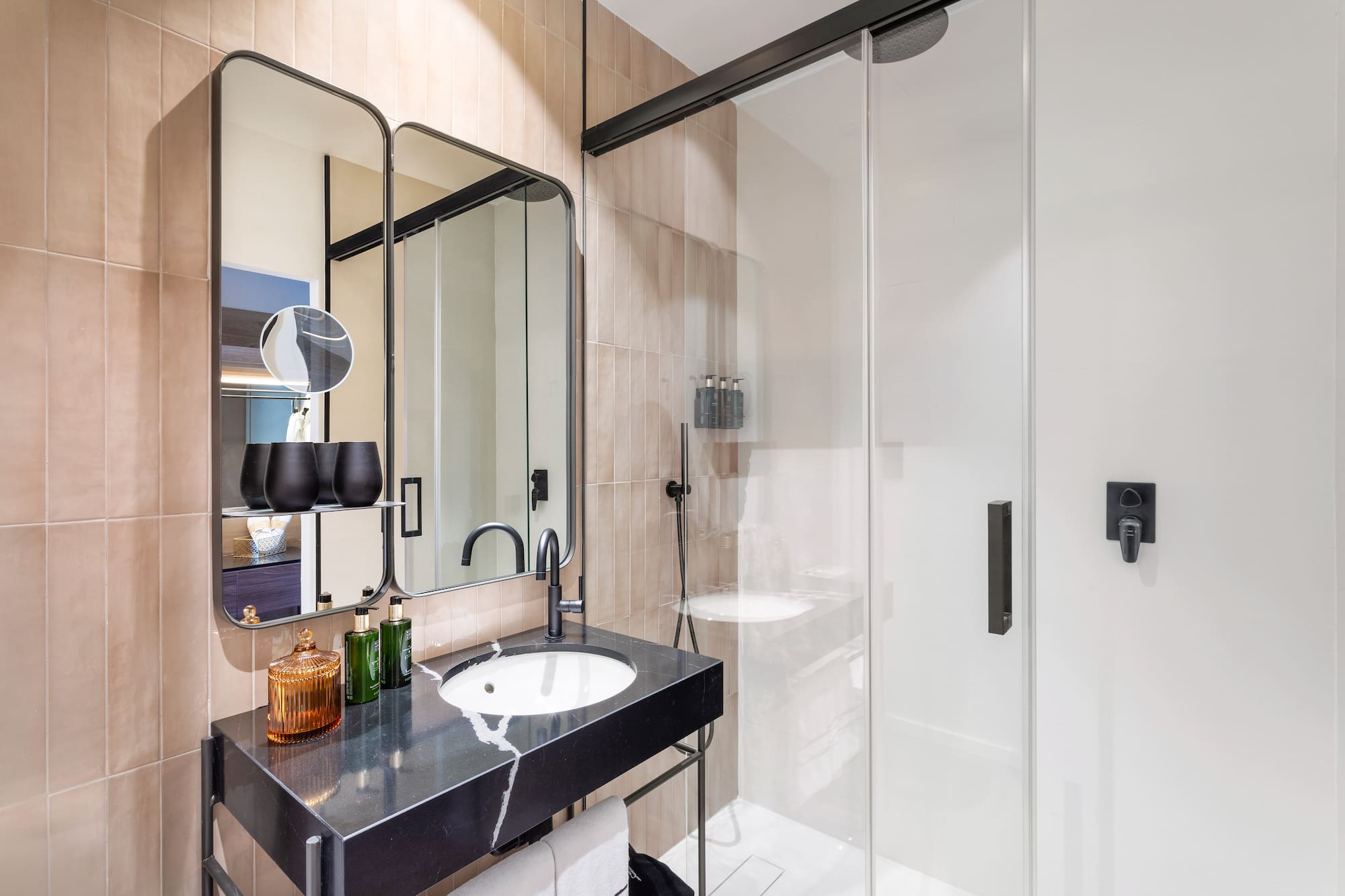 a bathroom with a shower and sink