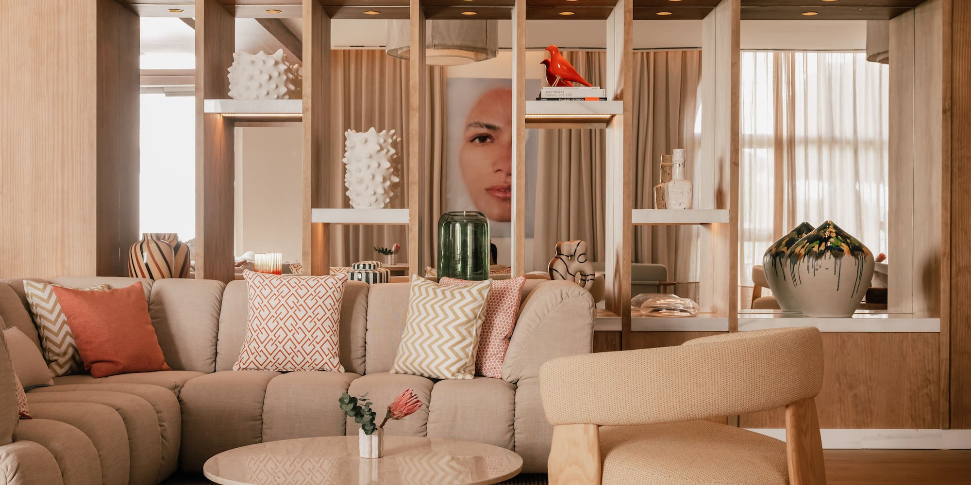 a living room with a couch and chairs