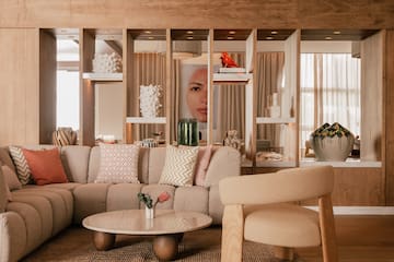 a living room with a couch and chairs