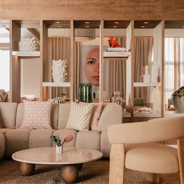 a living room with a couch and chairs