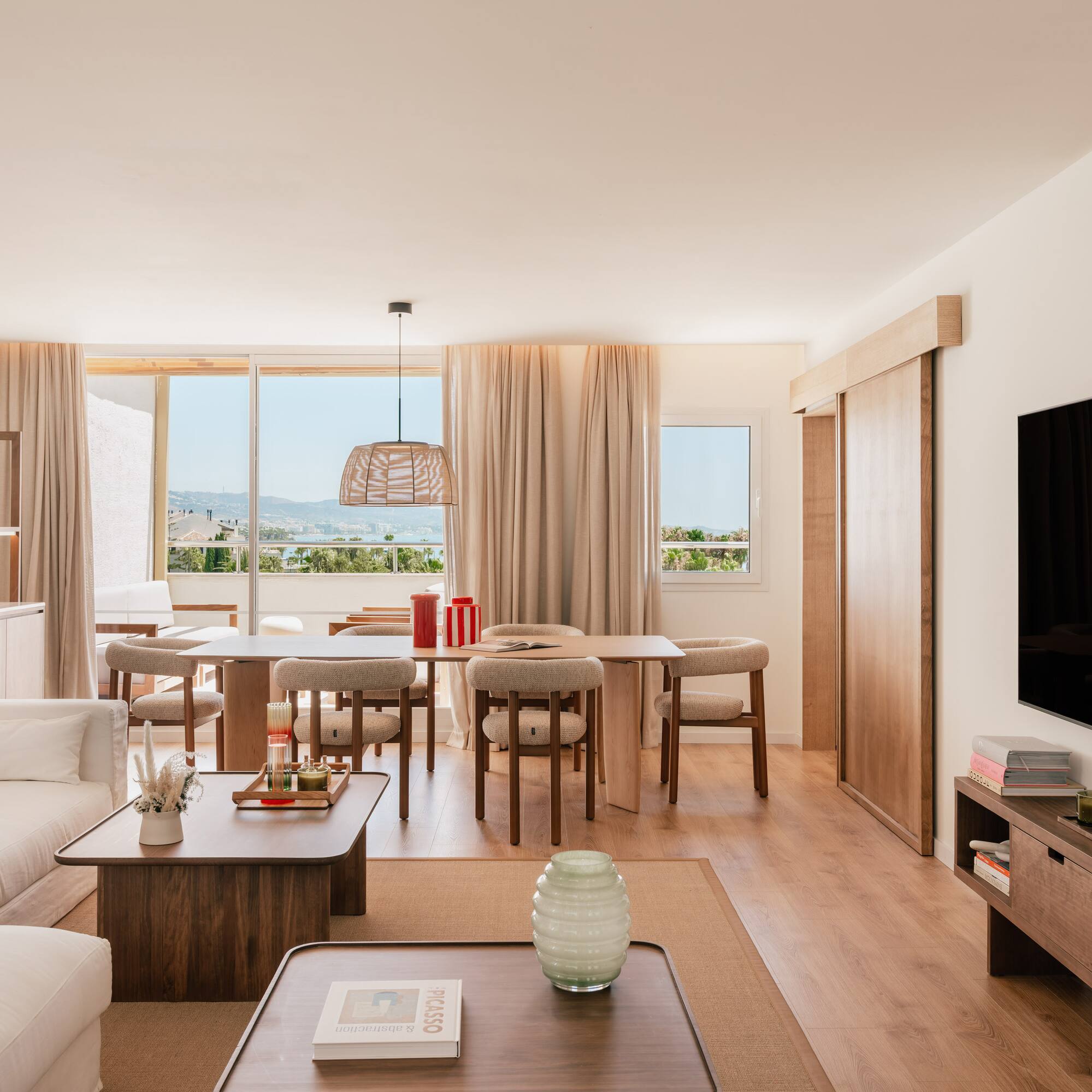 a living room with a television and a table