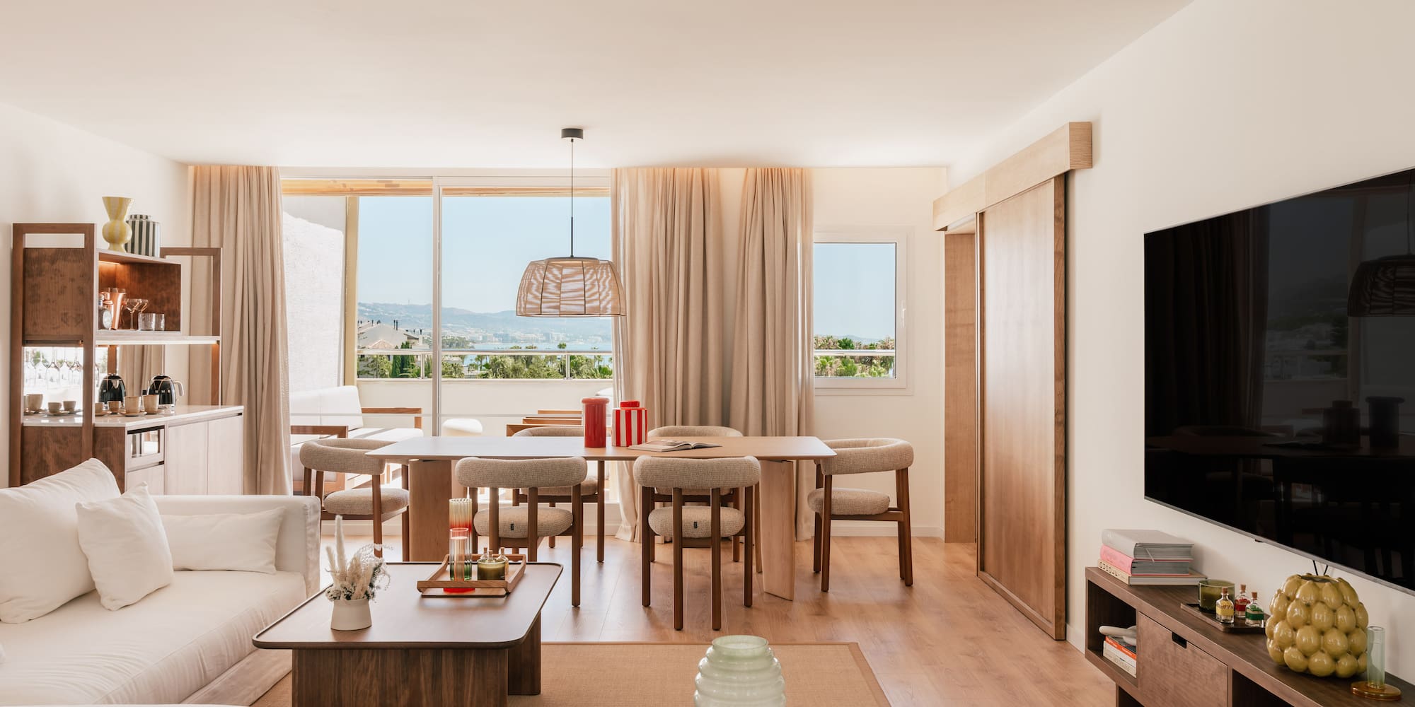 a living room with a television and a table
