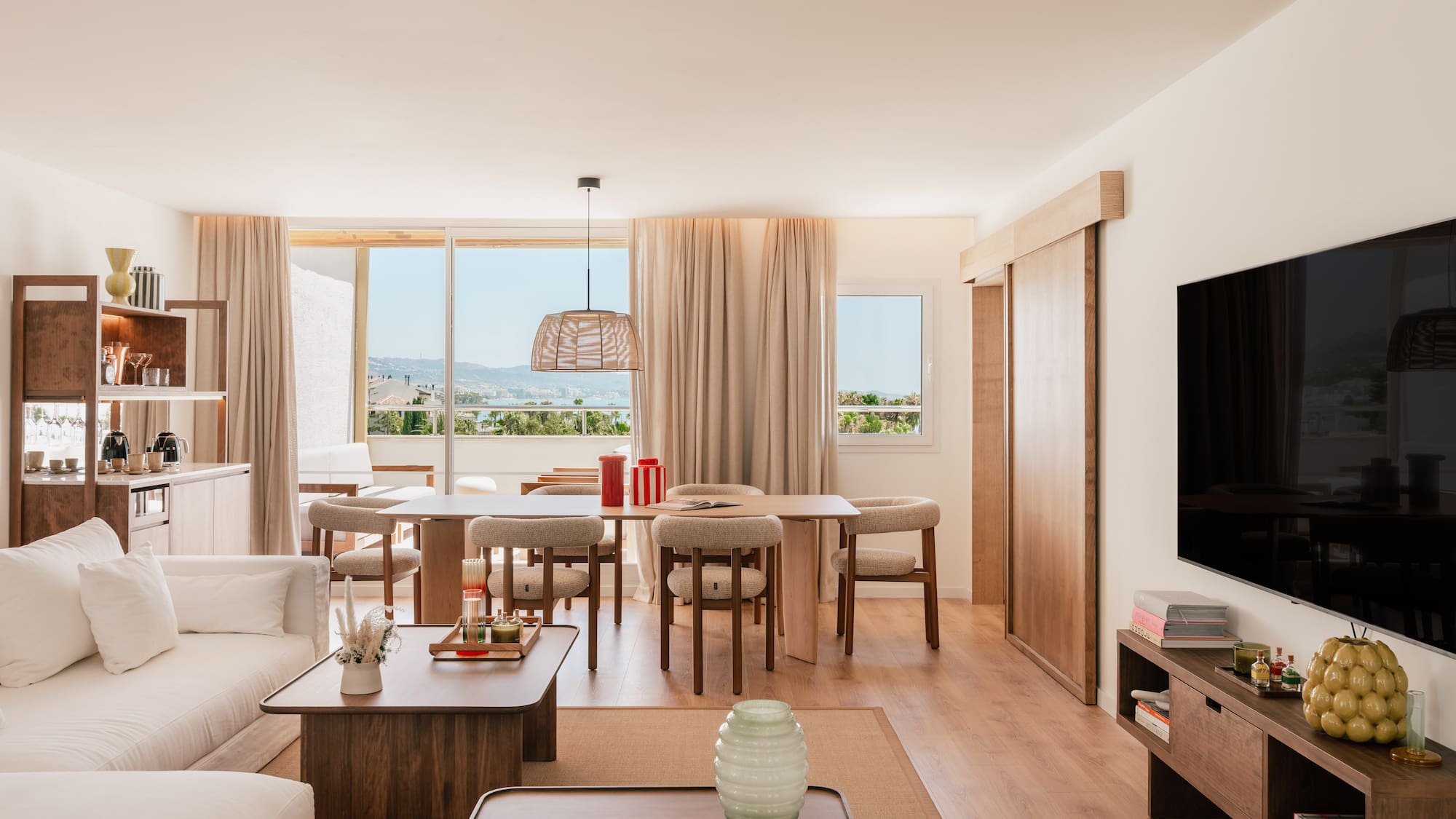 a living room with a television and a table