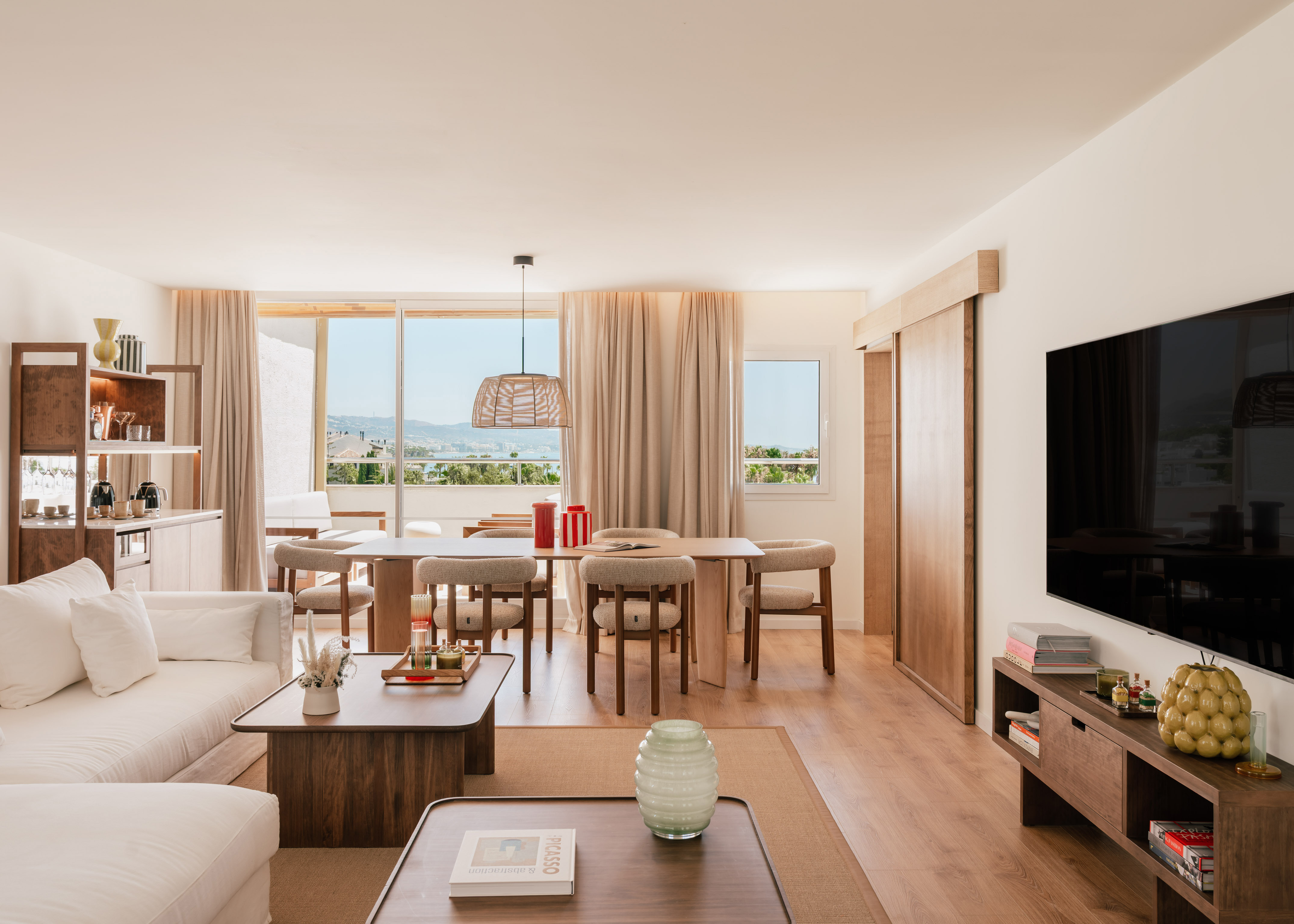 a living room with a television and a table