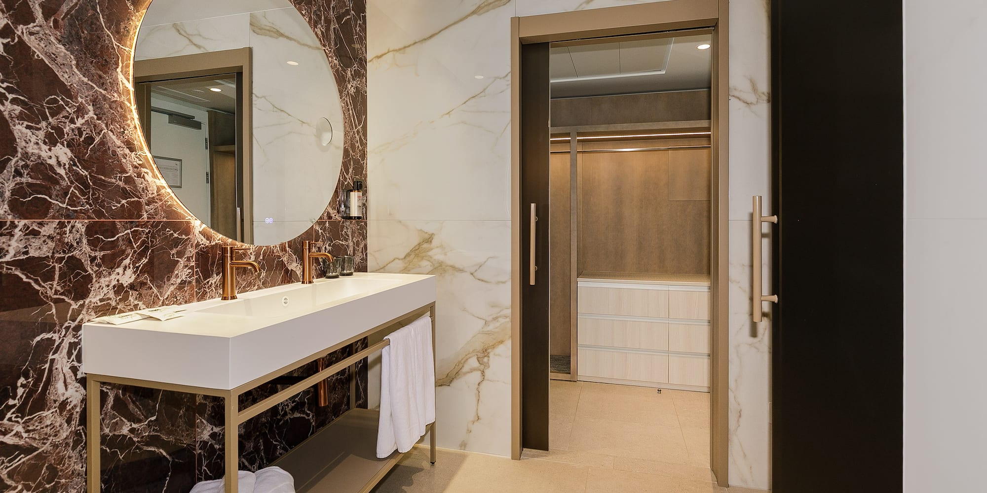 a bathroom with a mirror and a sink