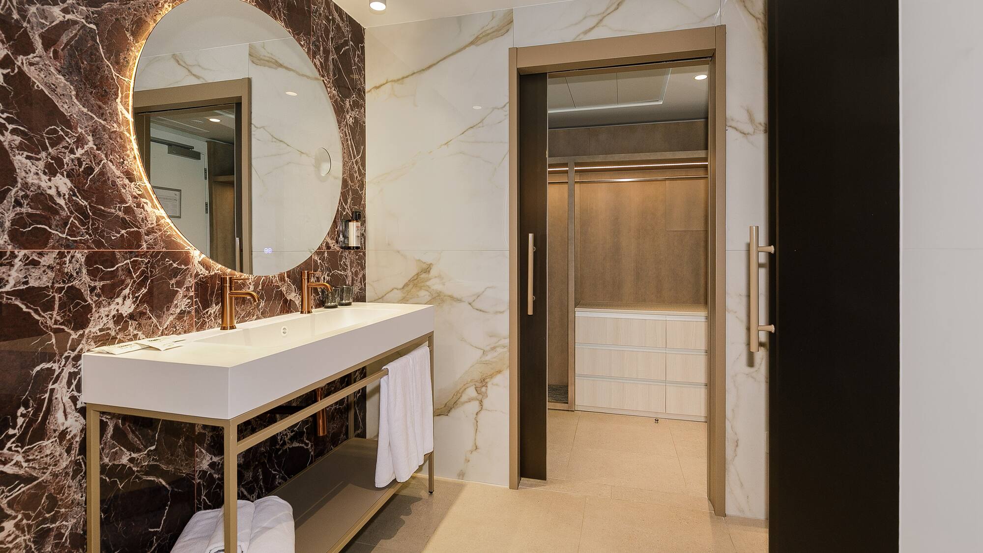 a bathroom with a mirror and a sink