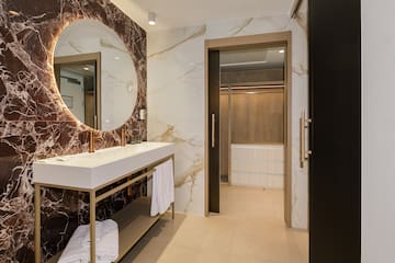 a bathroom with a mirror and a sink