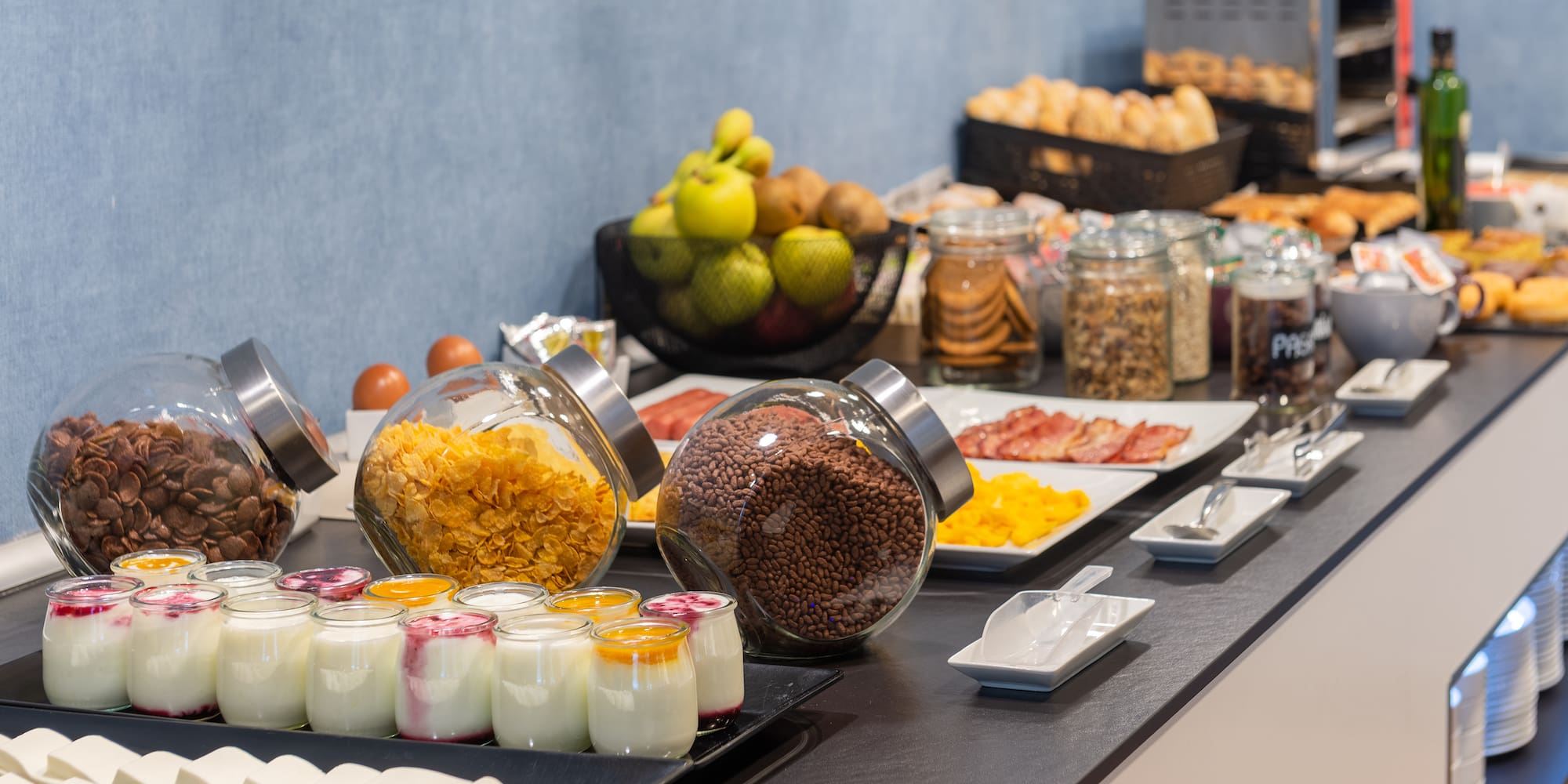 a buffet table with food and fruits
