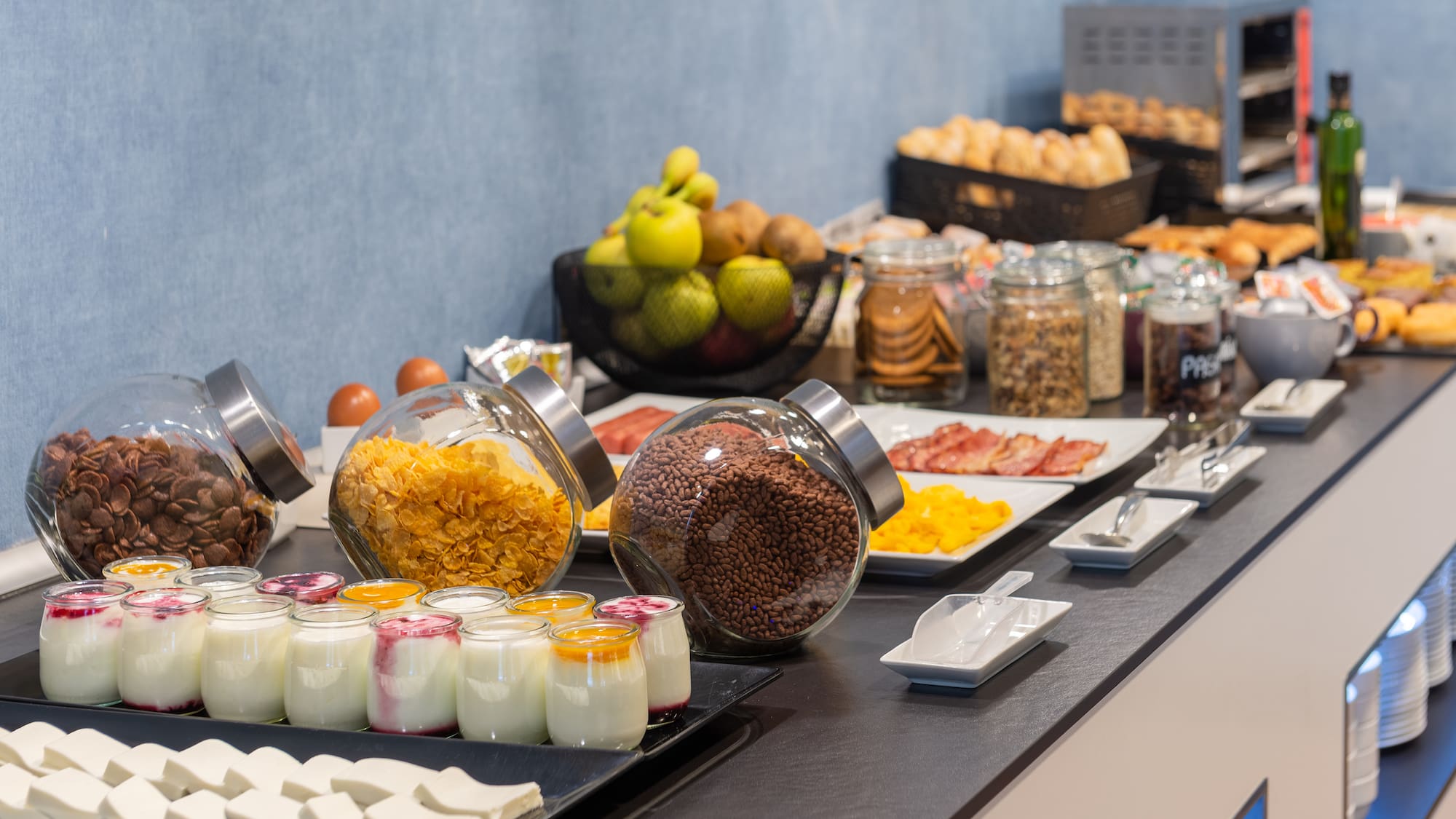 a buffet table with food and fruits