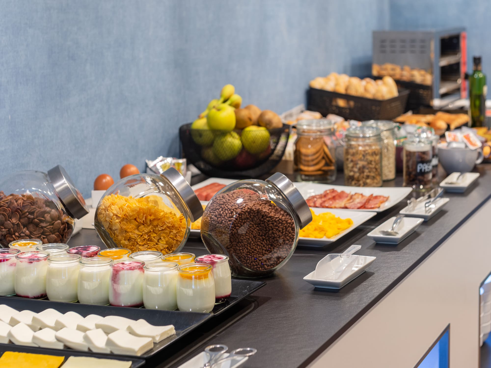 a buffet table with food and fruits