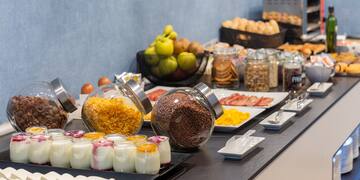 a buffet table with food and fruits