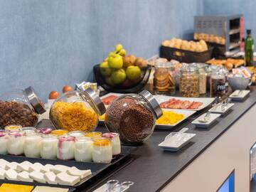 a buffet table with food and fruits
