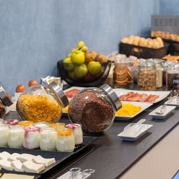 a buffet table with food and fruits