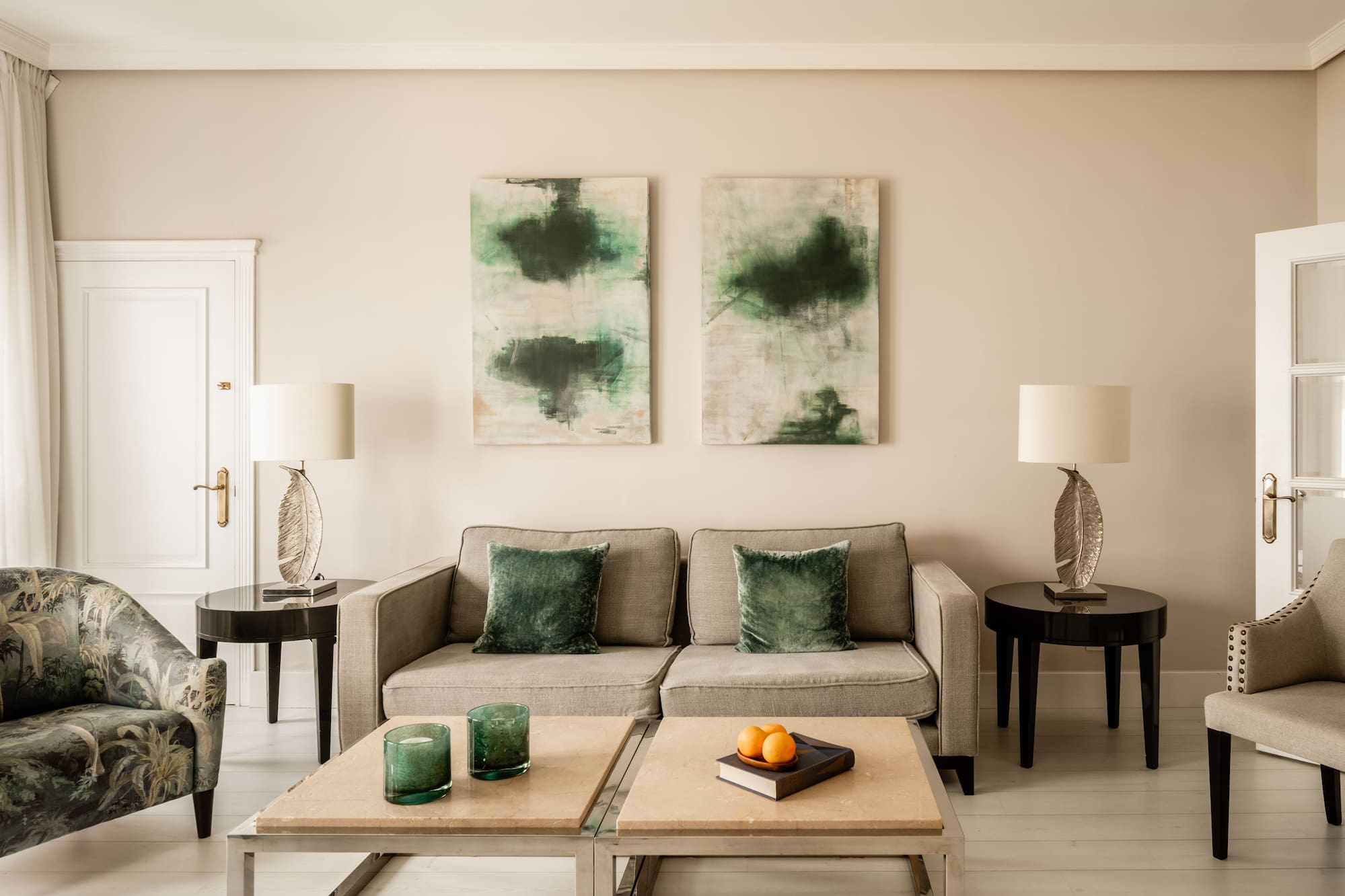 a living room with a couch and two tables