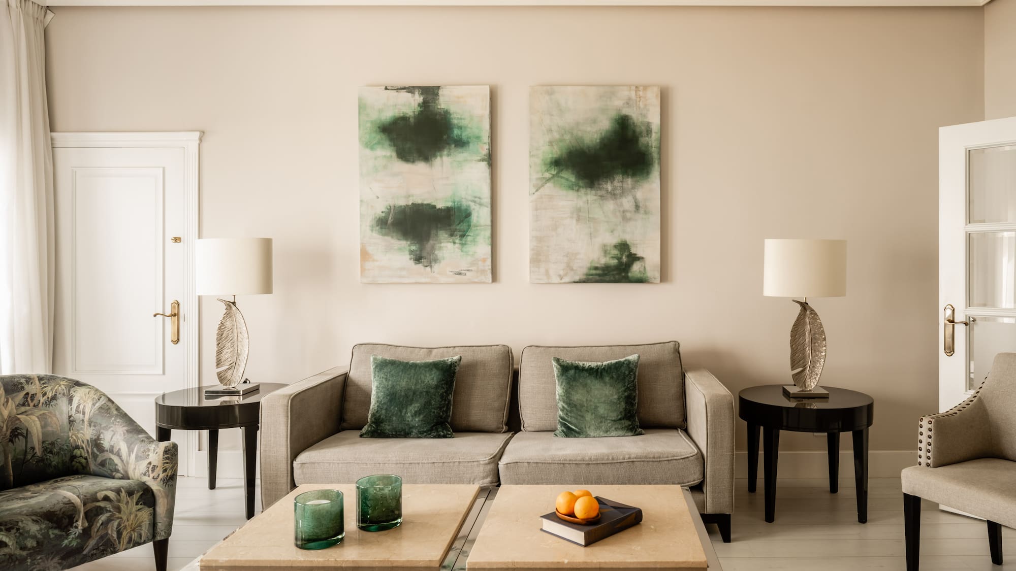 a living room with a couch and two tables