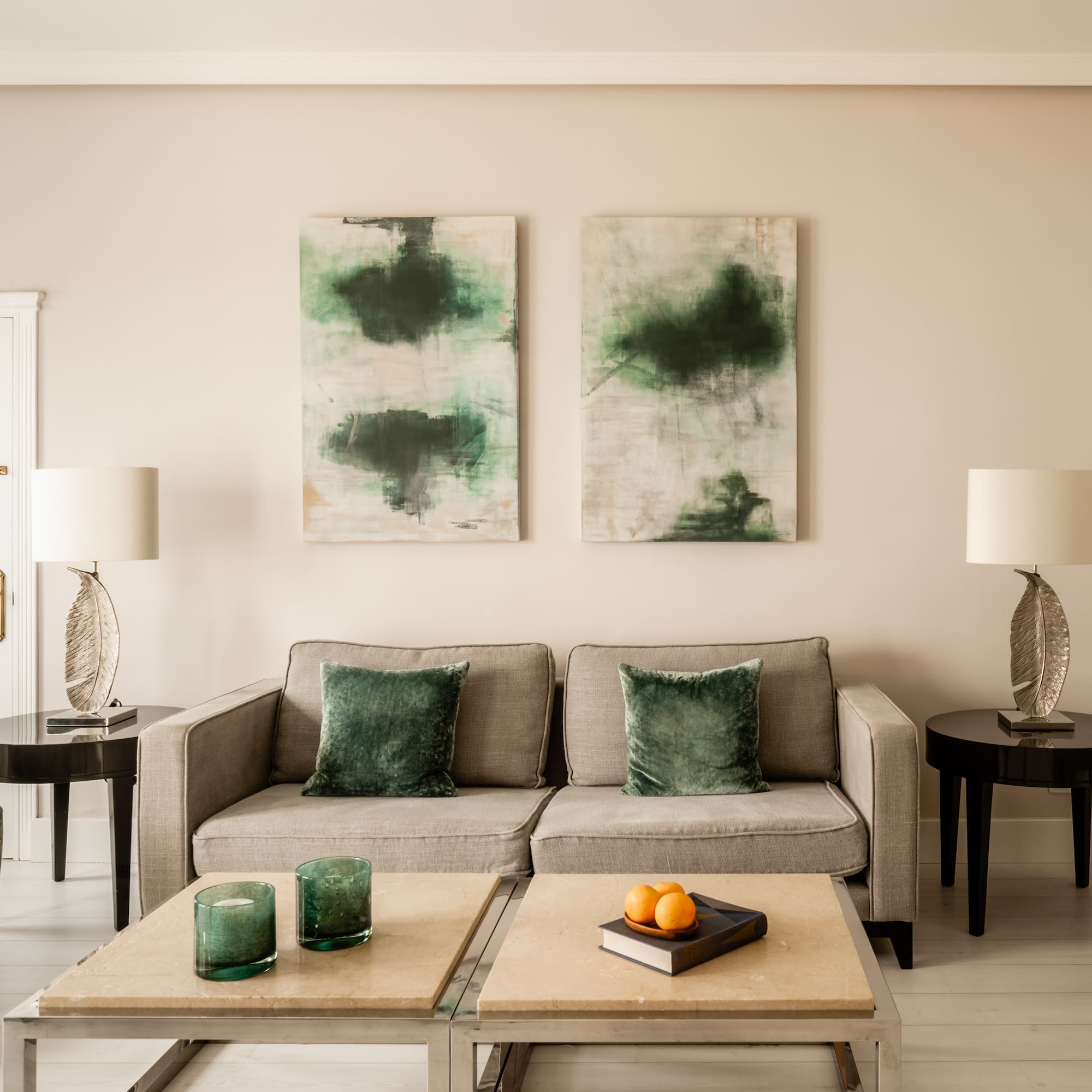 a living room with a couch and two tables