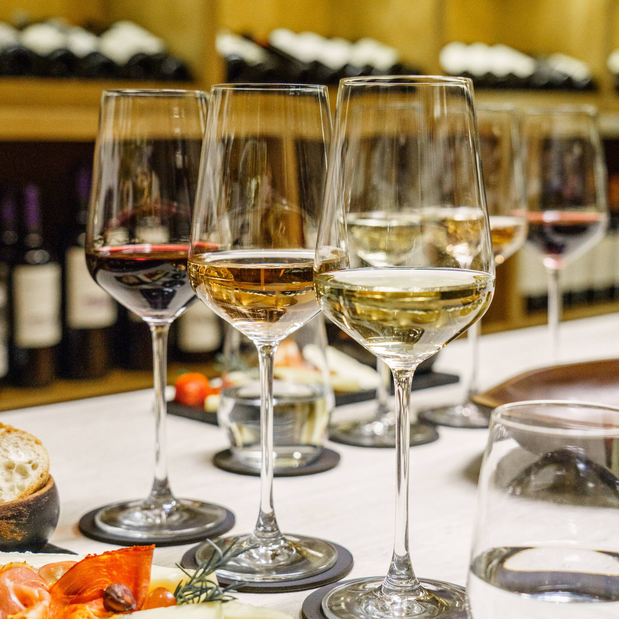 a group of wine glasses on a table