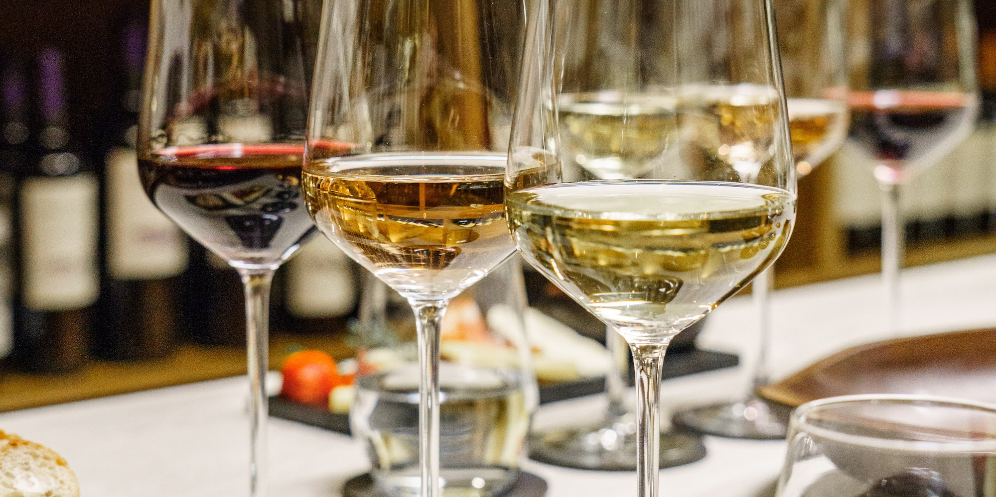 a group of wine glasses on a table