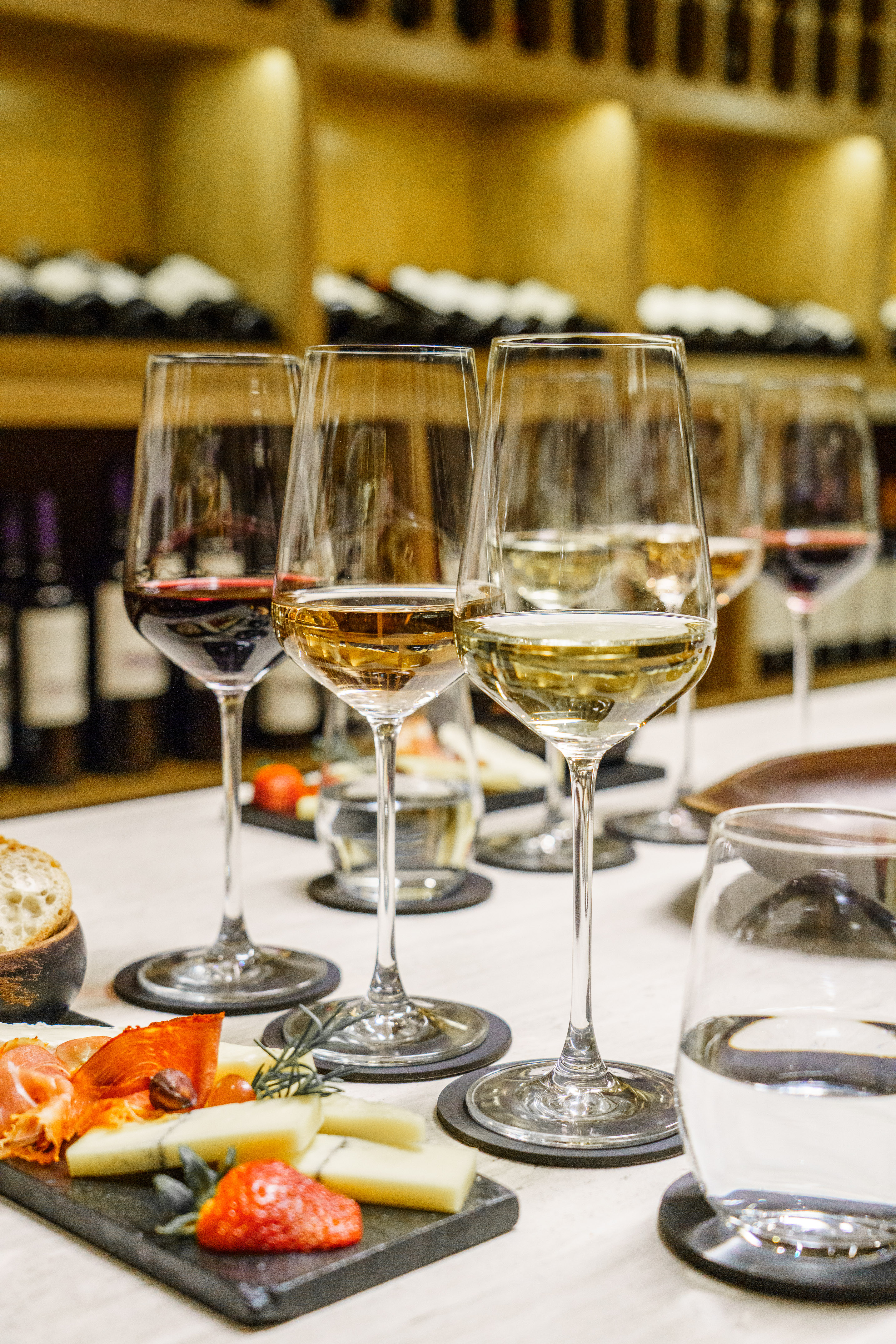 a group of wine glasses on a table