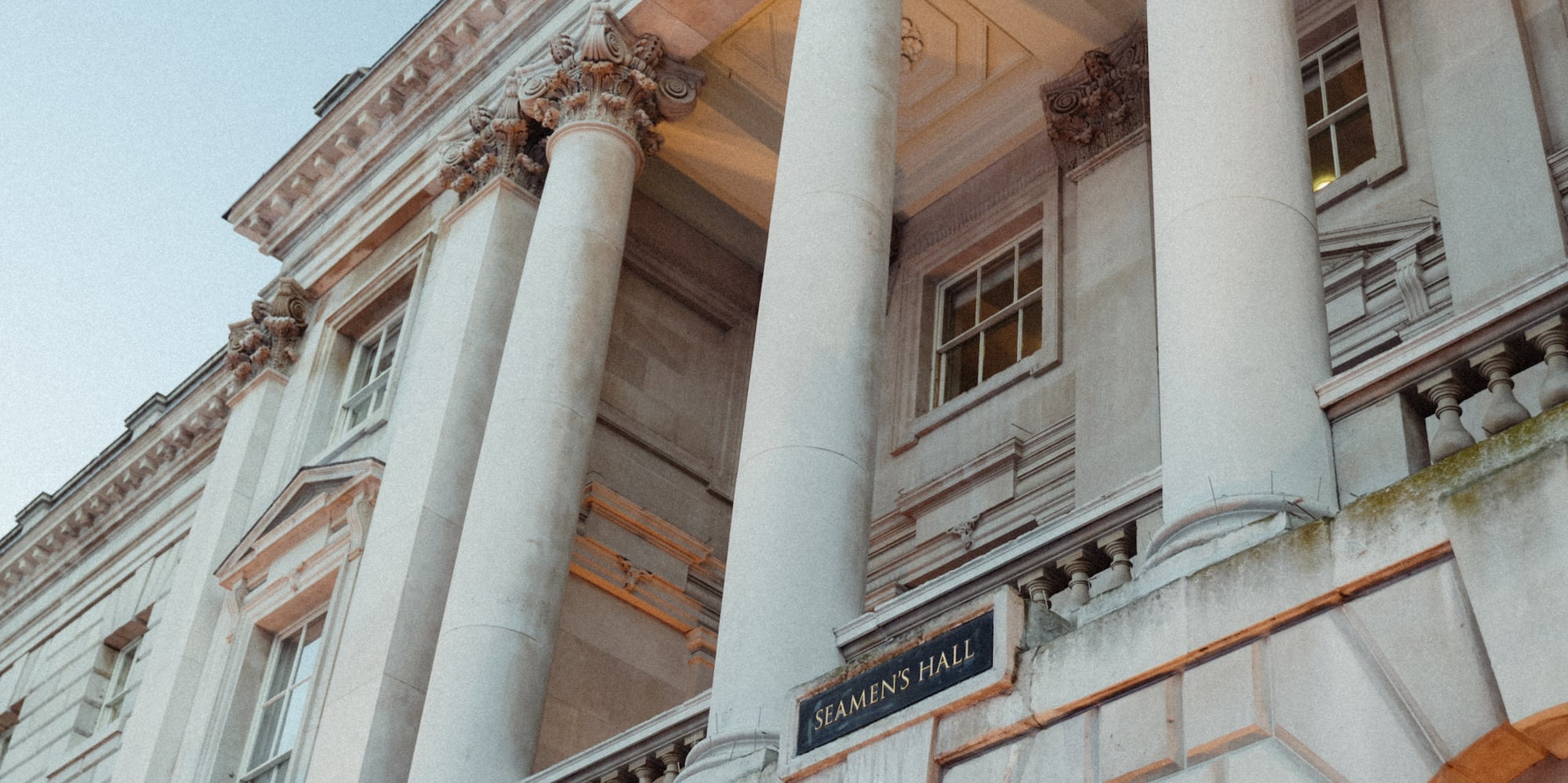 a building with columns and a sign