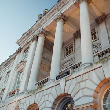 a building with columns and a sign