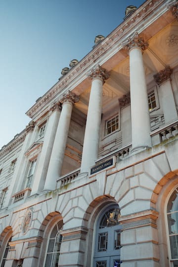 a building with columns and a sign