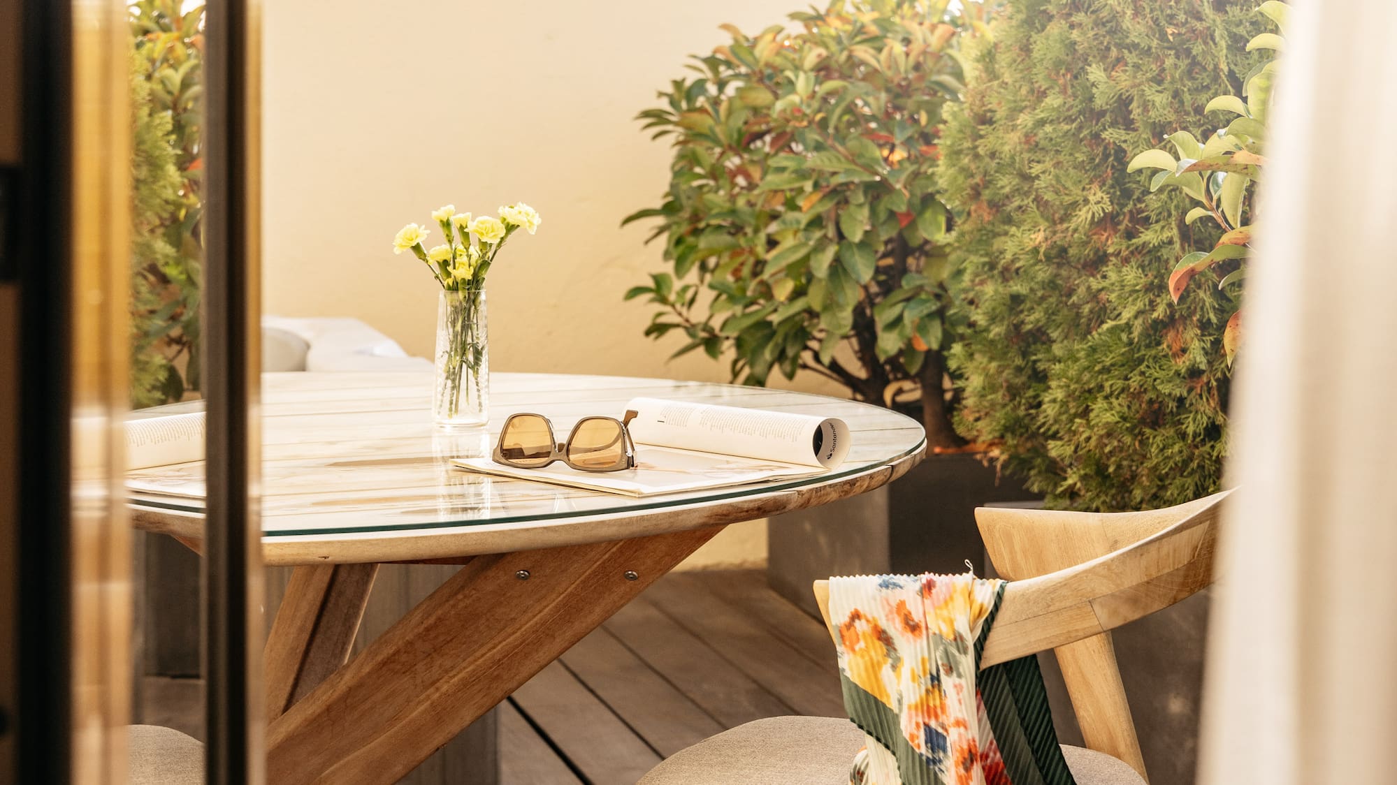 a table and chair on a deck