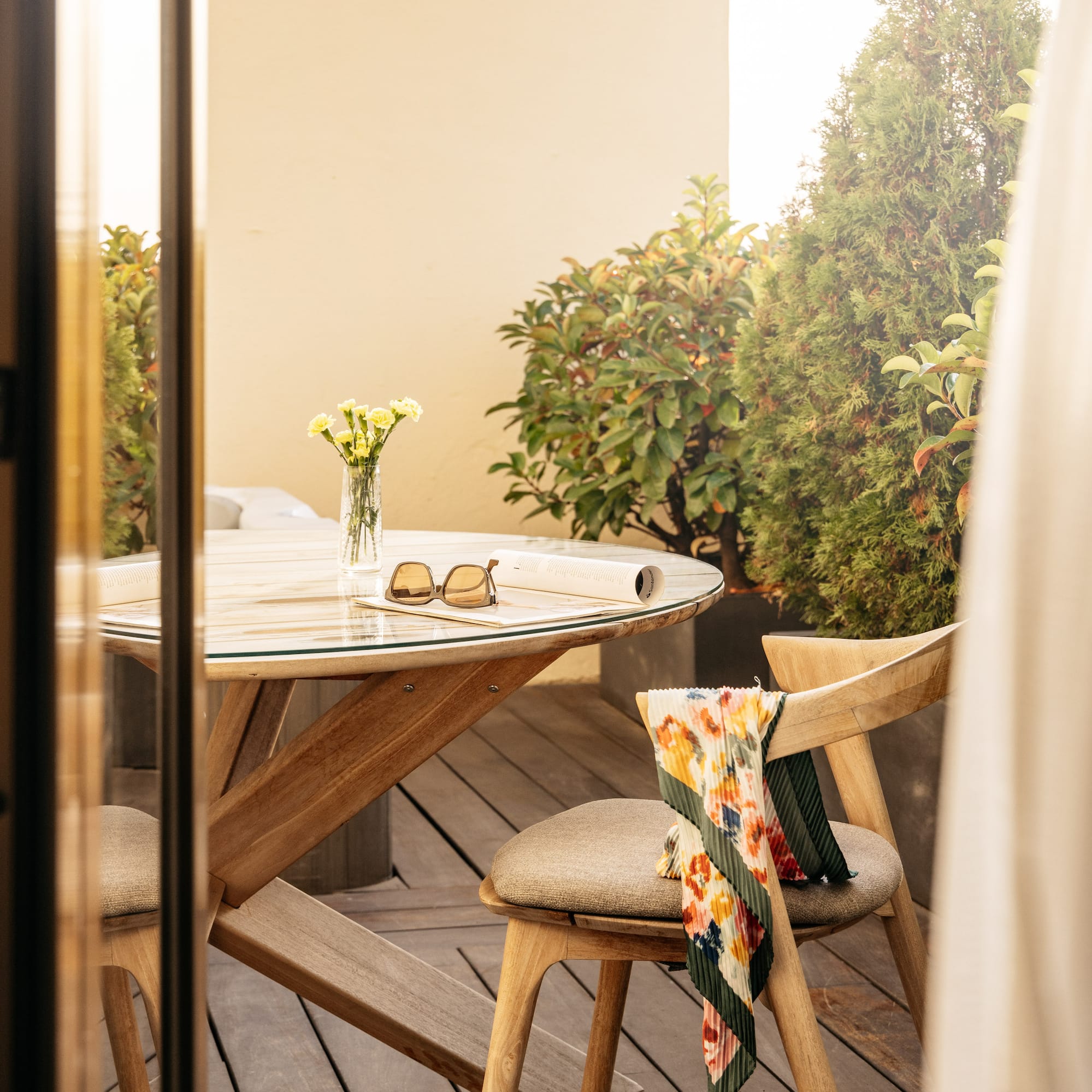 a table and chair on a deck