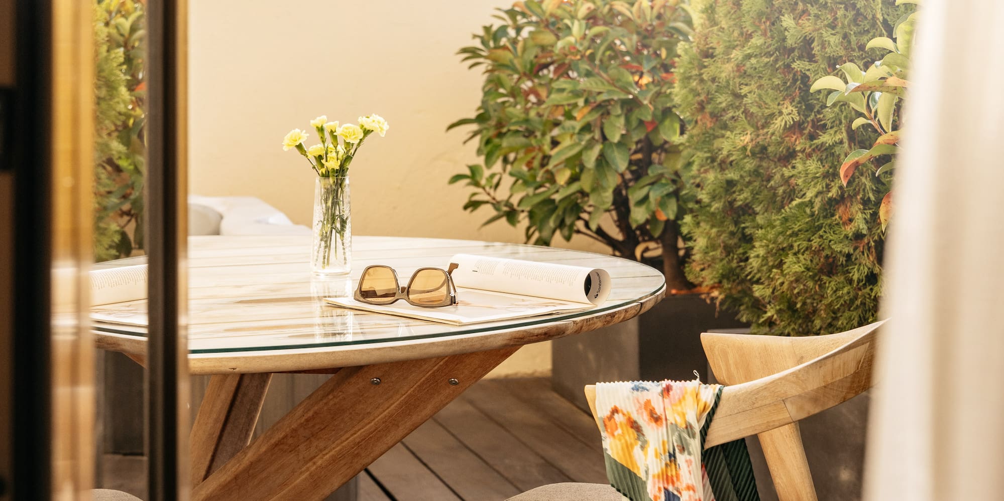 a table and chair on a deck