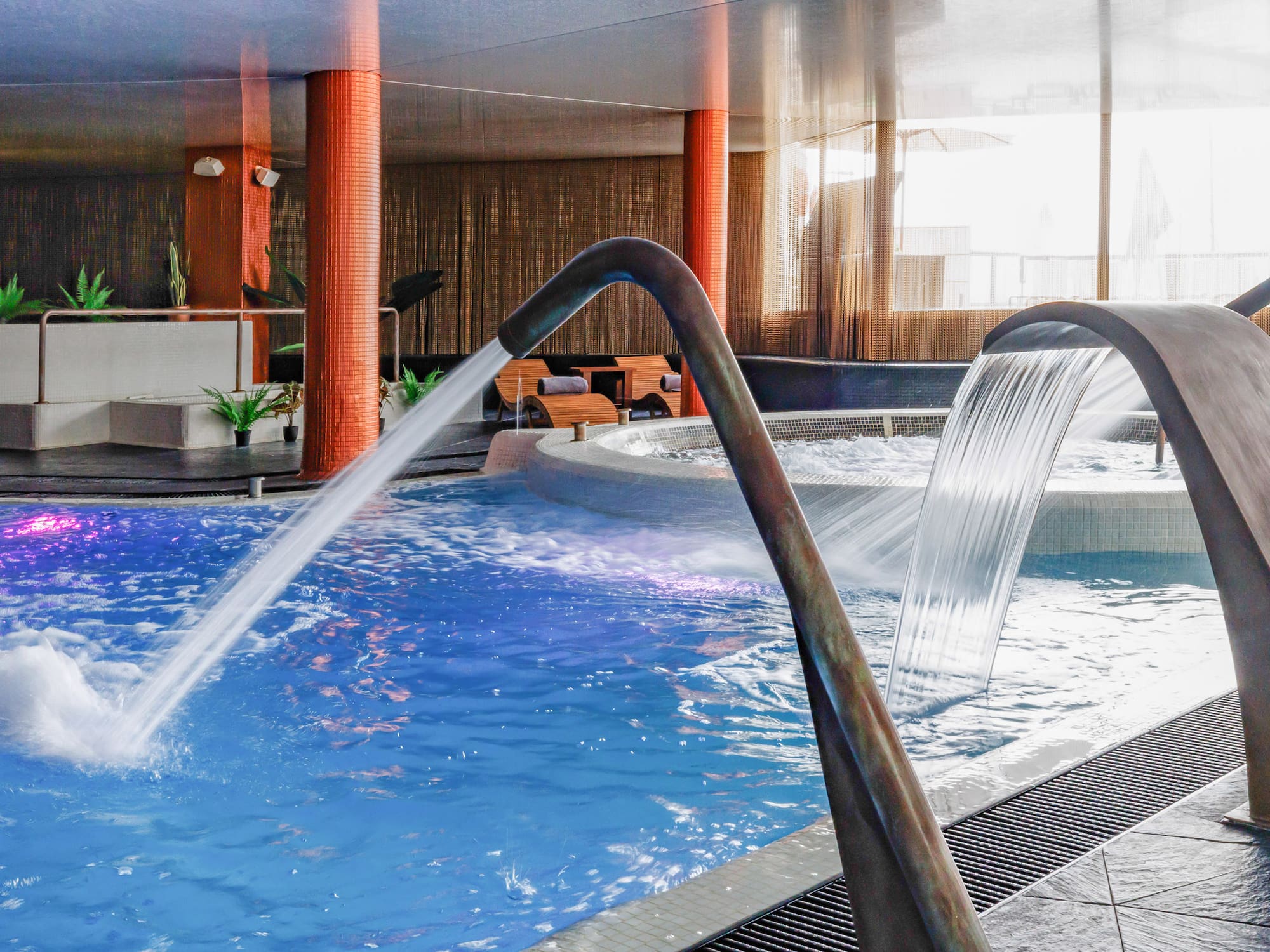 a pool with water pouring out of it