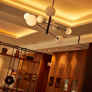 a chandelier with lights from the ceiling