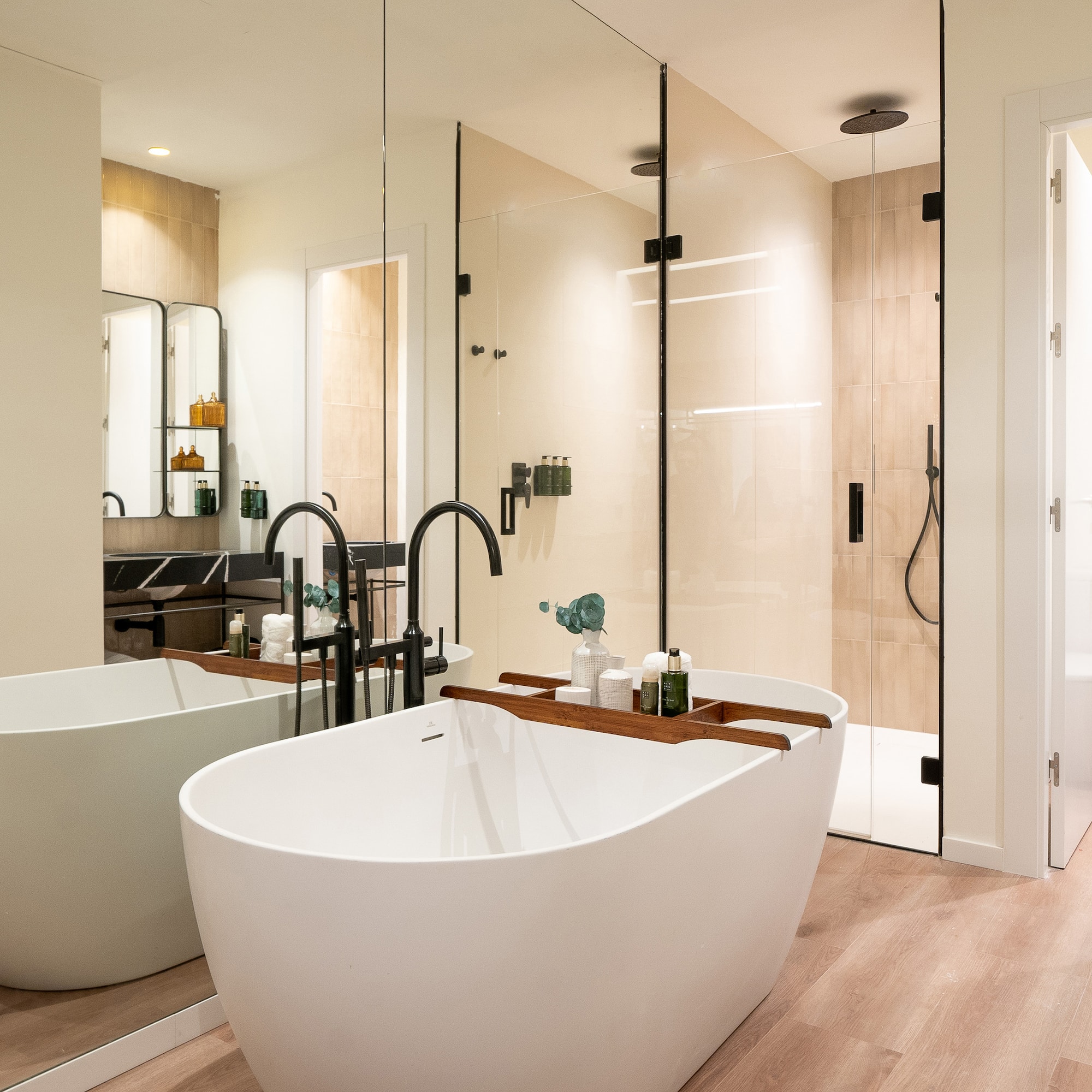 a bathroom with a tub and shower