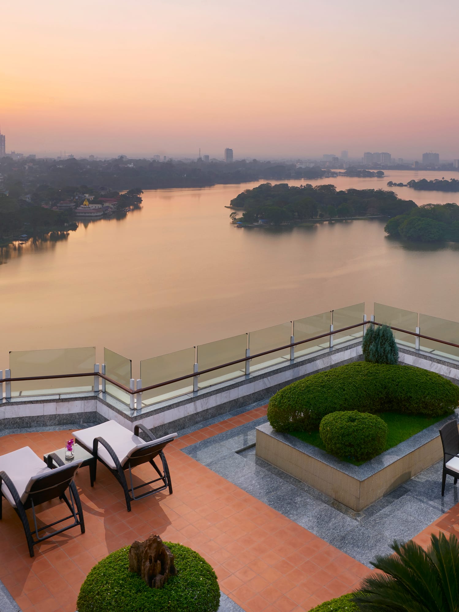 a rooftop patio overlooking a body of water